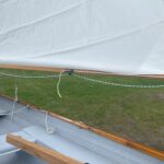 Well-mainted wood work on the sheer, tiller, and boom