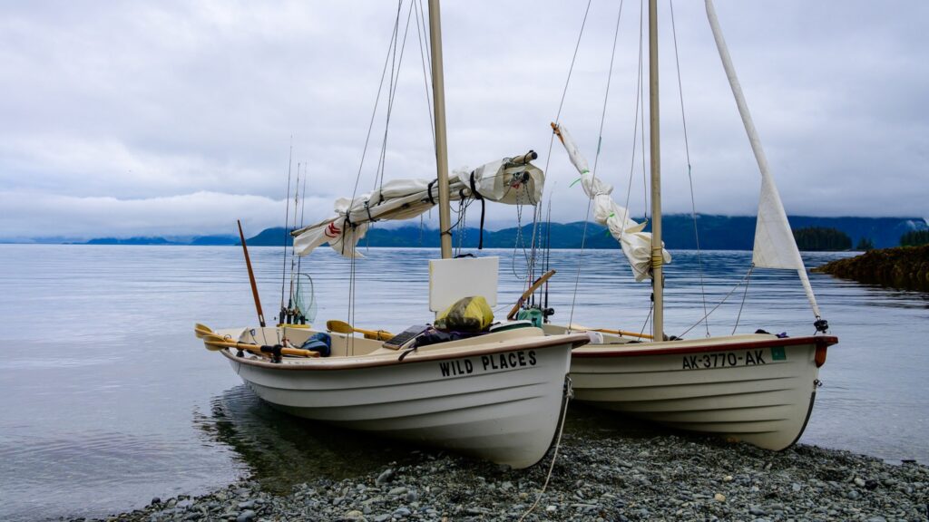 Salish Voyager and Jersey Skiff side by side on a beach in Prince William Sound