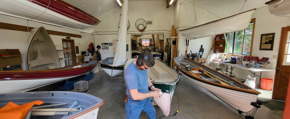 An unstaged photo from last spring, with 12 boats in the building at one time (and even more outside).