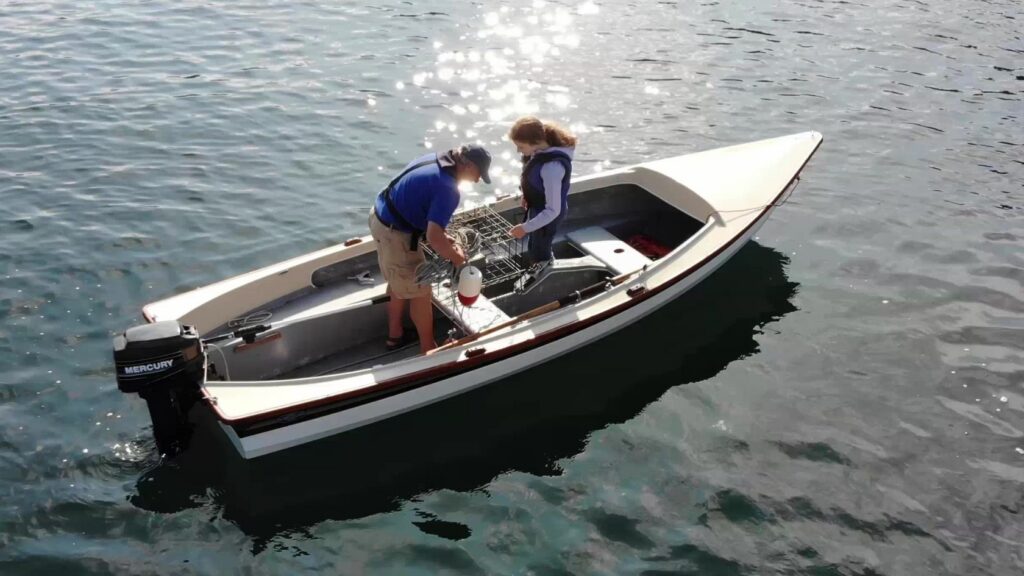 Grandfather and Granddaughter going crabbing in a Lobster Boat by Gig Harbor Boat Works